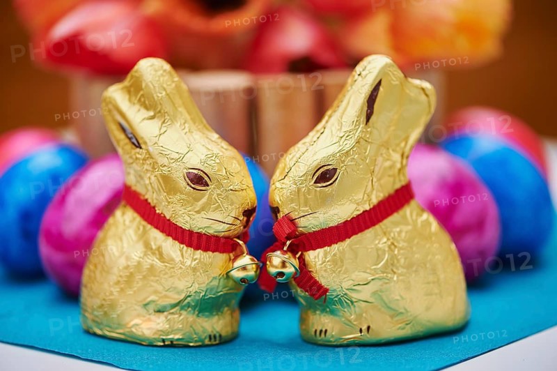 Decoration with colourful eggs and golden chocolate bunnies for easter, Germany