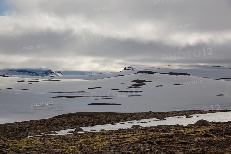 Snowfields at the Heidarvatn lake between Seydisfjördur and Eglisstadur in E Iceland