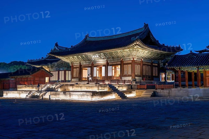 Myeongjeongjeon Hall, jeongjeon, main hall of the 15th century Changgyeonggung Palace illuminated at dusk in the capital city Seoul, South Korea