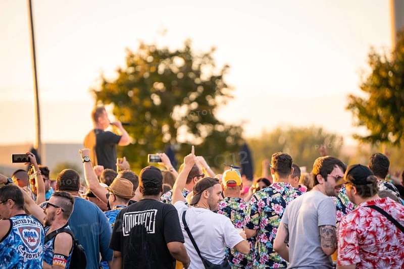 Large crowd at a concert, lots of colourful outfits and movement, Malleparty Böblingen, Germany