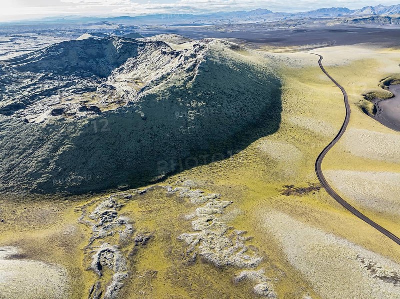 Mountain road F206 along moss-covered Laki crater or Lakagígar, series of craters, aerial view, interior highlands of Iceland, Suðurland, Iceland