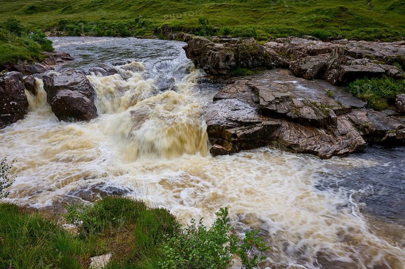 Rustling river flows over rocks in a green landscape, River Orchy, Bridge of Orchy, Scotland, United Kingdom, Great Britain