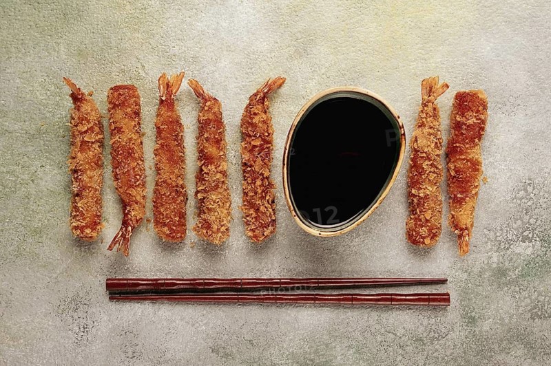 Fried shrimp, peeled in tempura, soy sauce, close-up