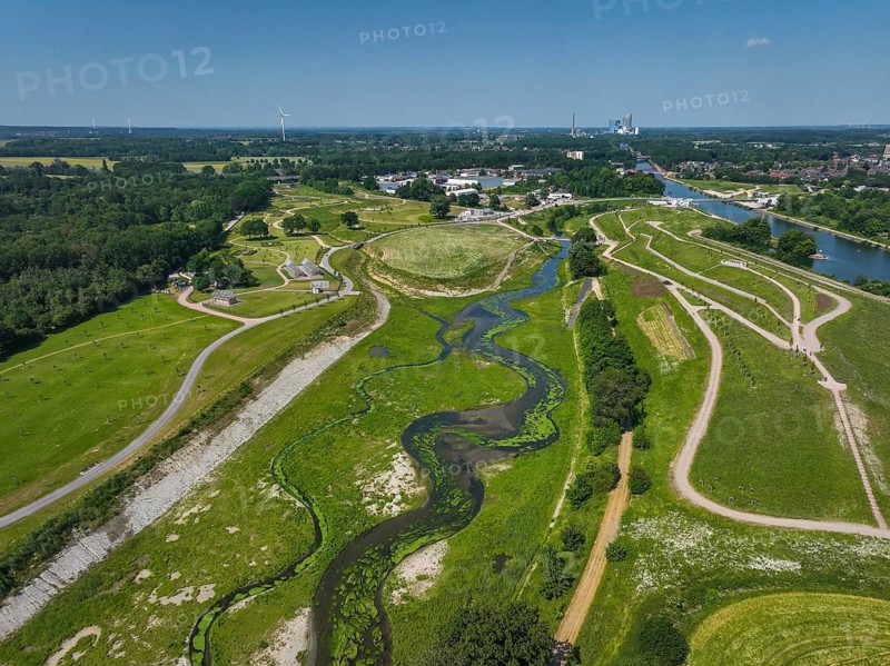Castrop-Rauxel, Recklinghausen, North Rhine-Westphalia, Germany, EMSCHERLAND adventure park at the Emscher-RHK water crossroads. EMSCHERLAND, an approximately 30-hectare water and nature adventure park at the water crossroads of the Rhine-Herne Canal (right) and the renaturalised Emscher (centre) on the city boundary of Recklinghausen and Castrop-Rauxel. The ecological focus at the confluence of the Suderwicher Bach (left) and Emscher (centre) will also be a future garden for the International Garden Exhibition 2027. Before the renaturation, the Emscher river system was an open, above-ground wastewater channel, combined sewer with surface water and wastewater. Where the Emscher, the Suderwicher Bach and the Rhine-Herne Canal meet, an inter-municipal adventure park has been created in recent years on an area of around 30 hectares. The park's facilities include a water playground, a water learning centre, a perennial garden, a beekeeper's house, a meadow orchard