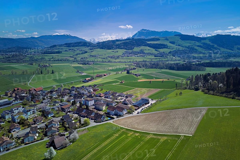 View of the village with the Alps with the Rigi in the background, Dietwil, Freiamt, Canton of Aargau, Switzerland