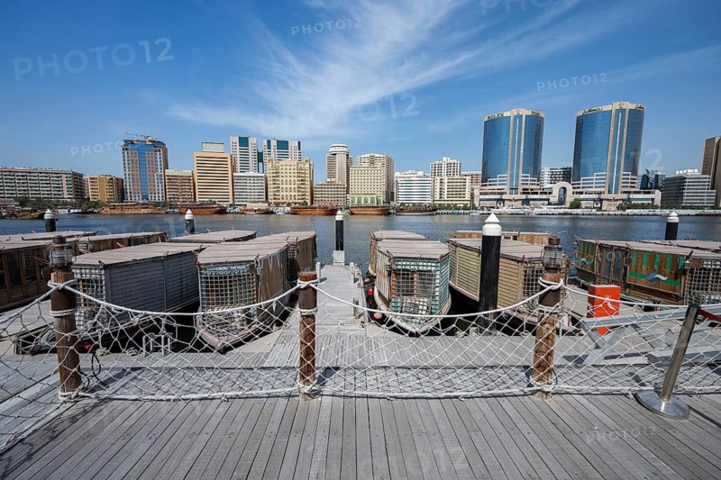 View of traditional boats and skyscrapers from Old Town Dubai, Dubai, United Arab Emirates