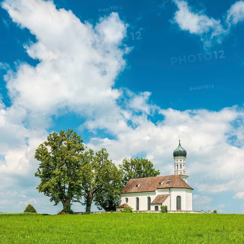 Church of St Andrew on a green meadow under a blue sky with cumulus clouds, also St Andrä, Pfaffenwinkel, near Etting, Bavaria, Germany