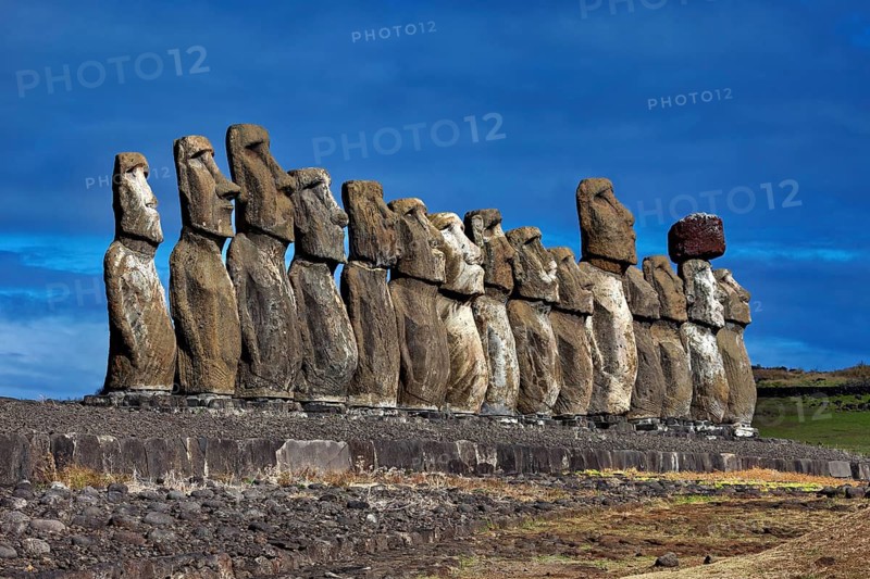 Row of Moai Statues on Easter Island against a clear blue sky, The Moai Statues on Easter Island in the Pacific Ocean