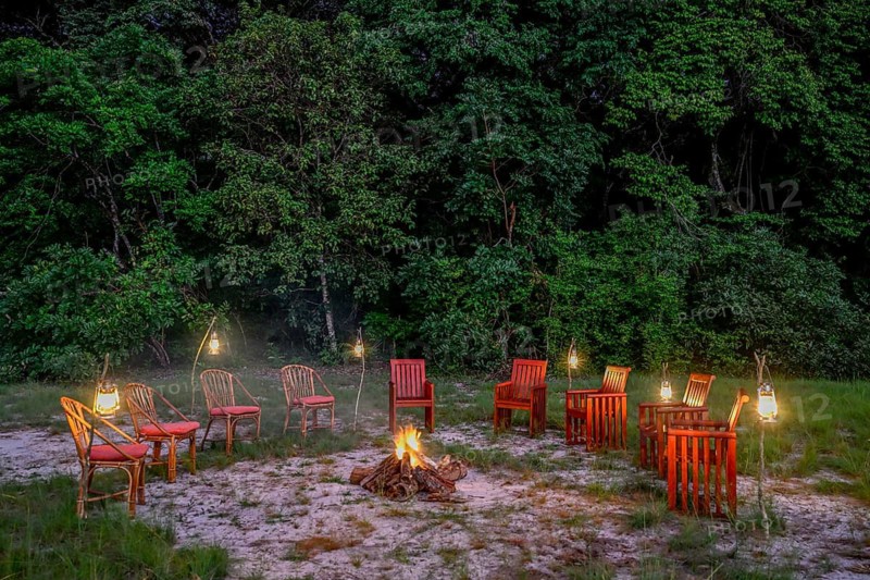 Chairs by the fire, Loango Lodge, Loango National Park, Parc National de Loango, Ogooué-Maritime Province, Gabon