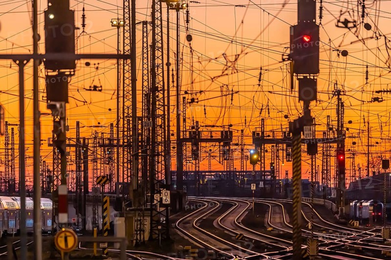 Track apron in the evening with sunset. Frankfurt am Main main station with rails, line mast and signalling systems. Symbolic photo for the infrastructure of Deutsche Bahn AG. Frankfurt am Main, Hesse, Germany