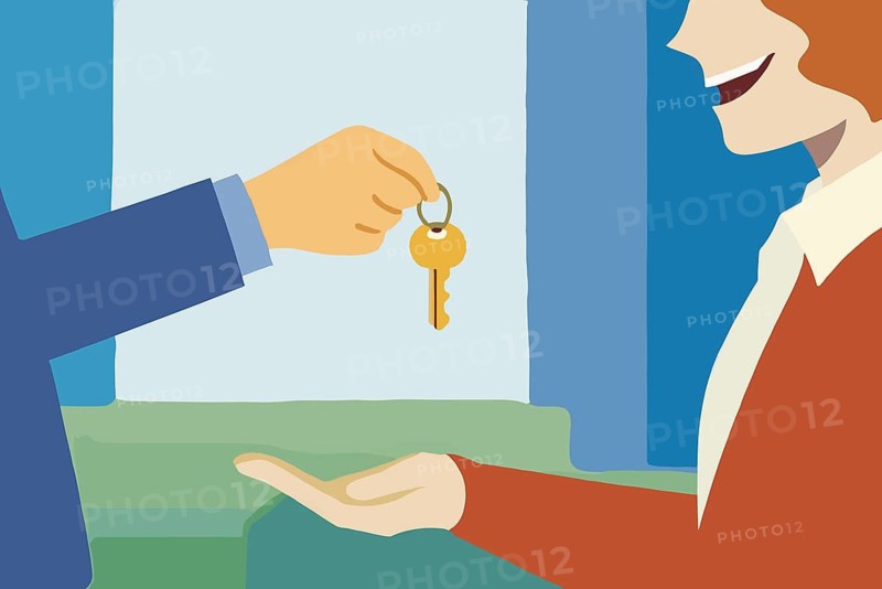 A real estate agent smiles as they hand over a key to a happy new homeowner, celebrating the successful completion of a property transaction in a welcoming environment