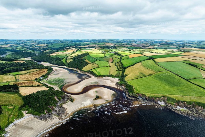 Cliffs over Mothecombe Beach and Red Cove from a drone, River Emme, Mothecombe, Plymouth, South Devon, England, United Kingdom