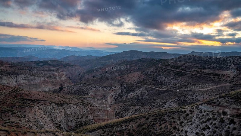Sunrise, wide hilly desert landscape with dry vegetation, Gorafe desert, semi-desert, Granada, Andalusia, Spain