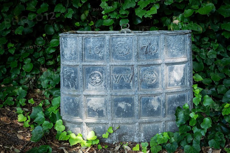 Old lead container dating from 1670, presumably for compost, Chelsea Physic Garden, historic botanical garden, oldest botanical garden in London, founded in 1673 by the Worshipful Society of Apothecaries, Chelsea, England, Great Britain