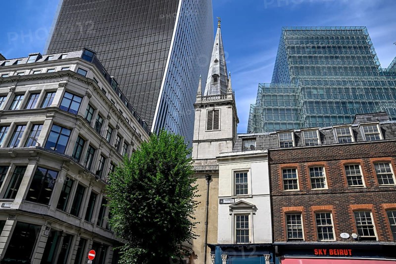 St Clement Eastcheap church tower in front of the skyscrapers of the Broadgate district, banking district, City of London, London, England, Great Britain, Great Britain