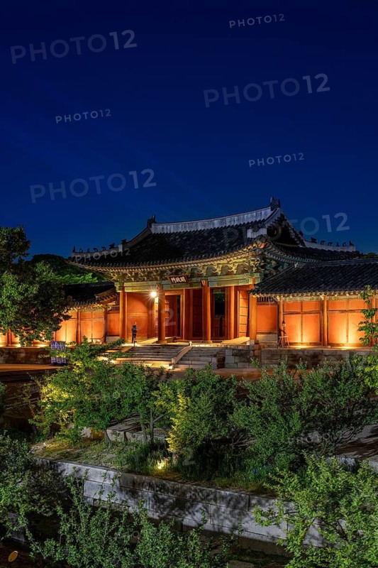 Myeongjeongmun Gate illuminated at night, entrance to the main hall of the 15th century Changgyeonggung Palace in the capital city Seoul, South Korea