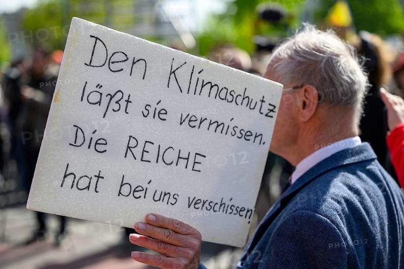 Man with sign They miss climate protection. The rich have shot us at the Fridays for Future International Climate Strike. CDU headquarters Berlin, 24.04.2026