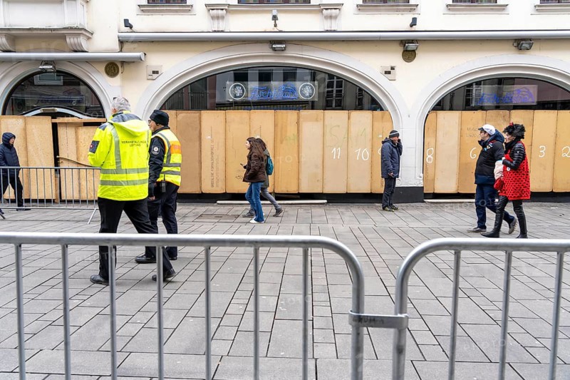Rose Monday parade in Düsseldorf, street carnival, in front of the parade in the old town, shops and restaurants have barricaded their shop windows