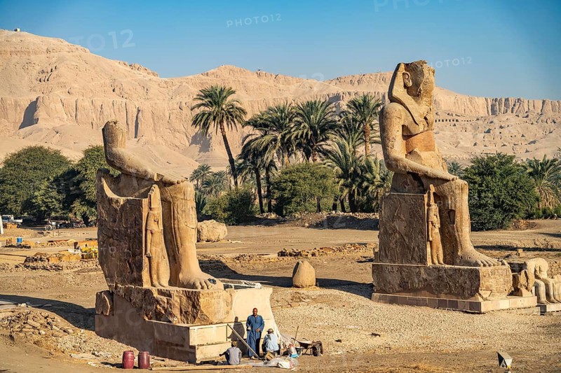 Statues in the ruins of the temple of Amenhotep III in the Nile Valley in West Thebes near Luxor, Egypt