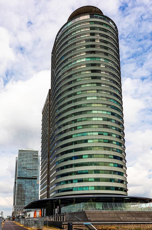 World Port Center, a distinctive skyscraper on Wilhelminapier in the harbor, by British architect Norman Foster, modern architecture in the city panorama, Rotterdam, the Netherlands