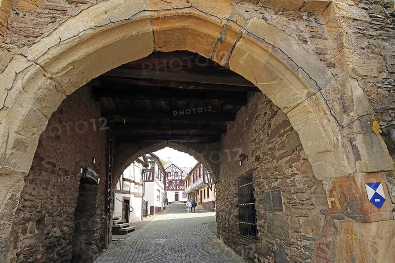 View through historic town gate, clock tower, landmark on clock tower alley, monument protection, sign, symbol, Herrstein, Hunsrück, Rhineland-Palatinate, Germany