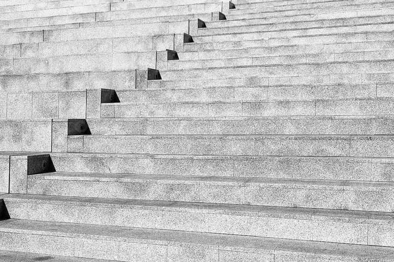 Dreary outdoor concrete staircase, bare steps in the city, detail, symbol image, wallpaper