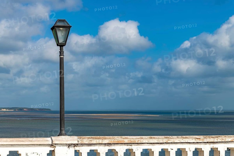 Wall and streetlamp on Beira Mar Avenue, with the sea in the background, in the city of Sao Luis, Maranhao, Sao Luis, Maranhao, Brazil
