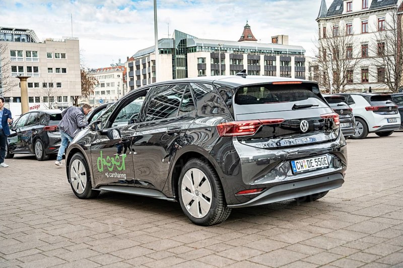 Rear view of a black Volkswagen electric car in a municipal parking lot, Deer, e-carsharing, Stuttgart, Germany