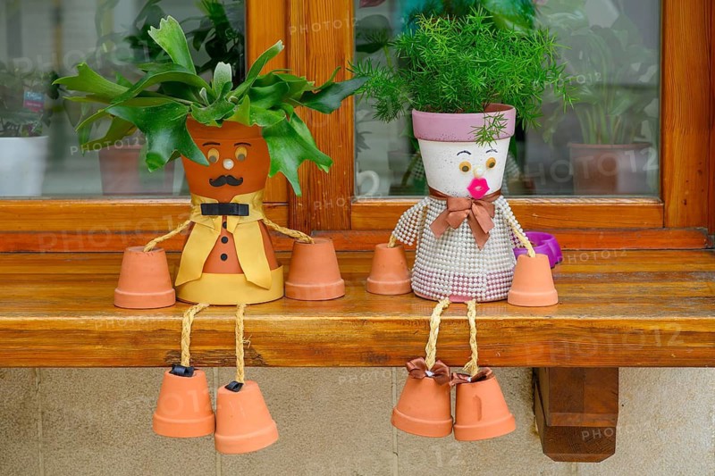 A window sill decorated with flowerpot characters in the Bašcaršija (Old Town) district ofSarajevo, Bosnia and Herzegovina