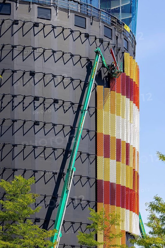 Spectacular timber high-rise building in Constance ahead of completion. The façade of the new Asisi Panorama building consists of three-dimensional metal elements in different colors. In future, the 52-meter high tower will display a huge panoramic painting from the Council of Constance, an important event in the city's history. Konstanz, Baden-Württemberg, Germany