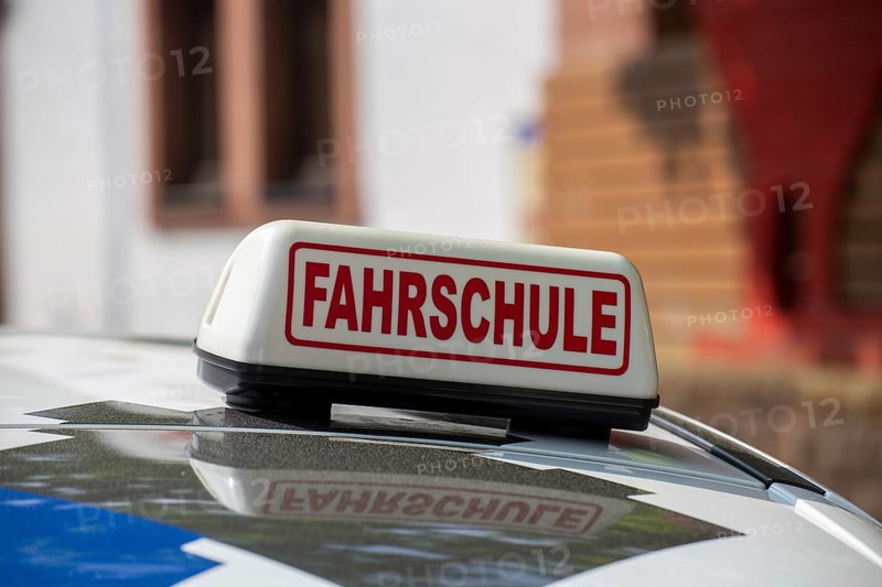 Close-up of a driving school sign in Germany