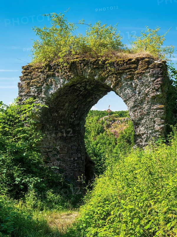 View through the castle gate of the castle ruins of the Questenberg in the Harz Mountains, remnants of pre-Christian customs in the karst landscape of the southern Harz, Saxony-Anhalt, Germany