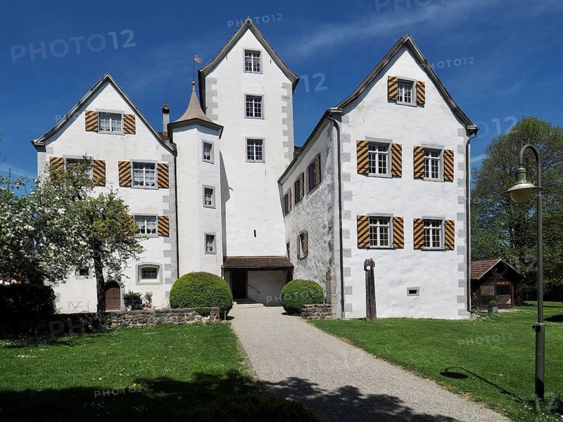 Historic white castle with shutters under a clear blue sky, Roggwil Castle, Roggwil, Canton of Thurgau, Lake Constance region, Switzerland