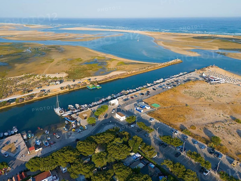 Harbour and small river running through a town, with boats and sandy areas, aerial view, Fuseta, Fuzeta, Faro, Algarve, Portugal