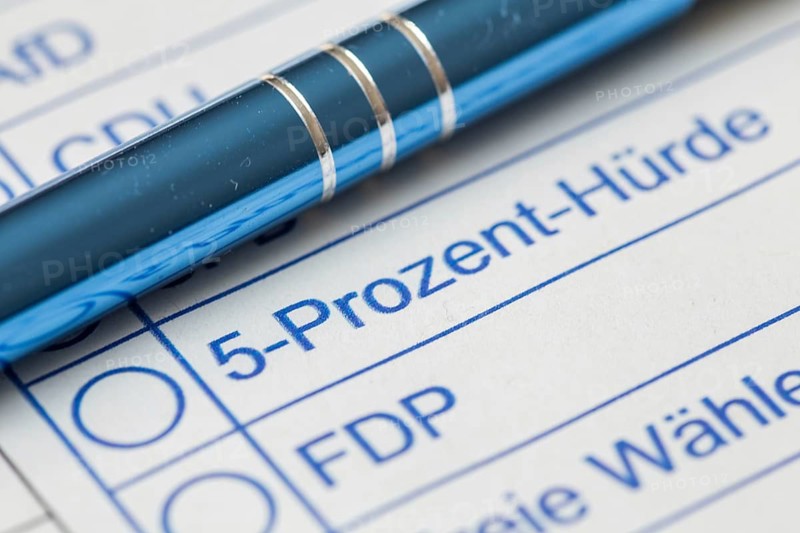 Close-up of a symbolic ballot paper with the text 5 PERCENT HURDLE