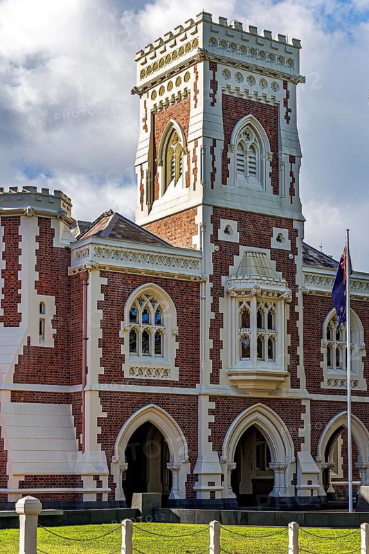 Auckland High Court heritage building with Gothic Revival castellated tower, red brick and white stone, Auckland, New Zealand