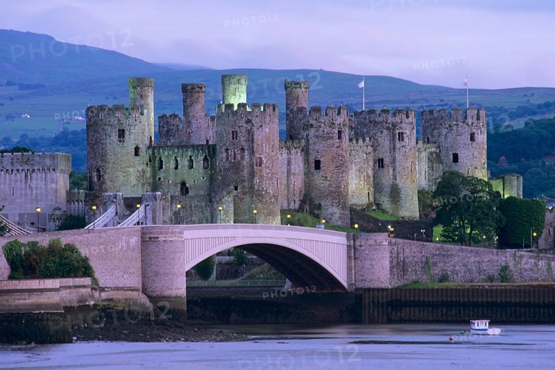 Conwy Castle at dusk beside the Conwy estuary, North Wales, United Kingdom