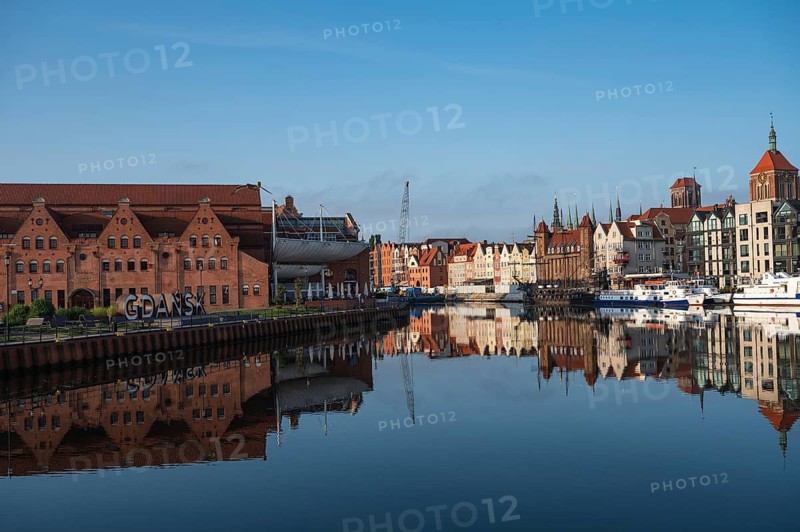 GDANSK, POLAND - SEPTEMBER 6, 2023: River Motlawa and cityscape during summer day