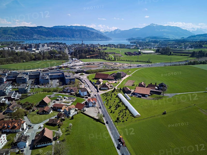 View of Lindencham with the motorway entrance, Lake Zug and Mount Rigi in the back, Cham, Canton of Zug, Switzerland