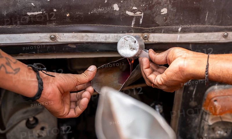 A fuel station attendant refuels a auto rickshaw at a petrol pump in Guwahati, India, on March 11, 2026. Oil prices reversed course from recent highs, slipping to around 90 USD a barrel after remarks by U.S. President Donald Trump on the Iran conflict. Markets remain unsettled as traders monitor the evolving geopolitical situation