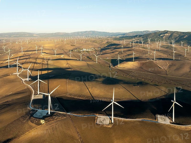 Windmills on a wind farm near Zahara de los Atunes. Aerial view. Drone shot. Cádiz province, Andalusia, Spain