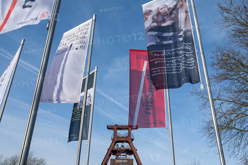 Double trestle headframe, flags in front of it, Shaft XII, Zollverein Coal Mine Industrial Complex, UNESCO World Heritage Site, Essen, Ruhr Area, North Rhine-Westphalia, Germany