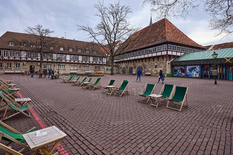 Gastronomy, outdoor area with tables and chairs, half-timbered houses, concrete paving stones, bare wintry trees, lantern, old town, diffuse light, cloudy, Ballhofplatz, Hanover, state capital, Hanover region, Lower Saxony, Germany