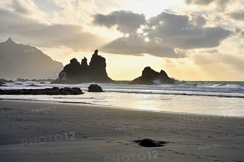 Dramatic clouds with rock formation at sunset on the beach of Playa de Benijo, Tenerife, Canary Island, Spain