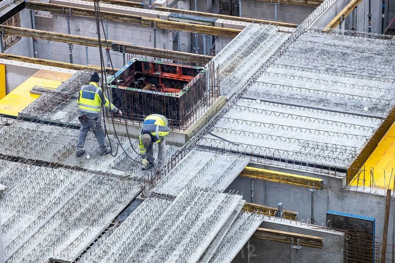 Construction site, installation of semi-precast floor slabs, which are then filled with in-situ concrete