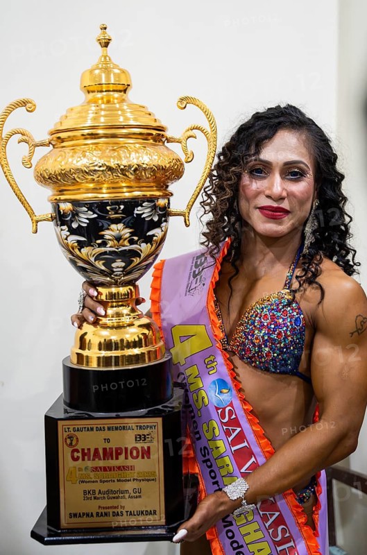 Competitor Barnali Basumatary, the winner of the 4th Ms Saraighat all India classic body building championship, poses with trophy on March 23, 2025 in Guwahati, India