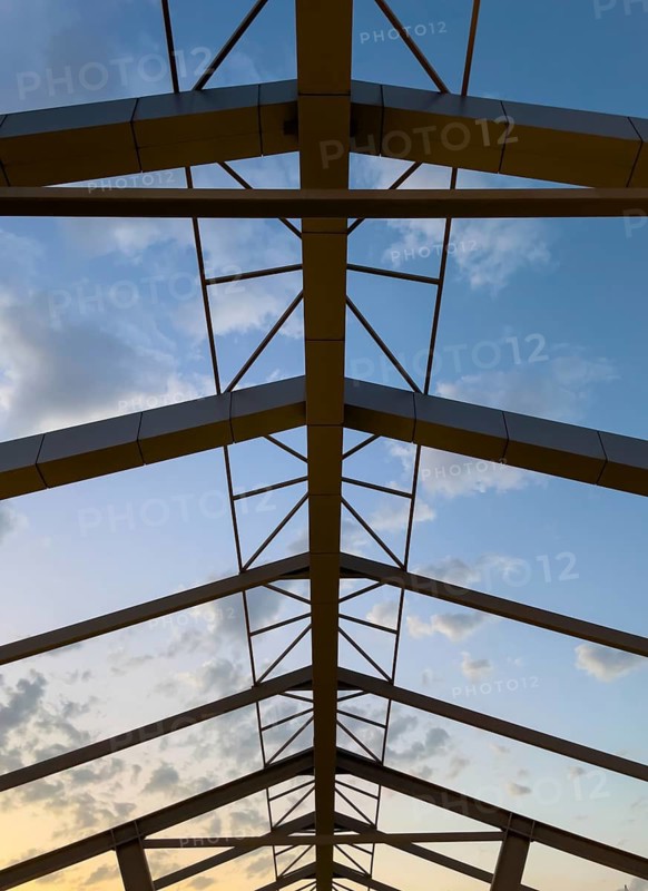 Abstract architecture shapes against a blue sky at sunset
