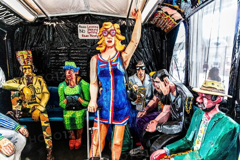 Sculpture The Bus by artist Red Grooms, depicting hectic city life with various passengers, FENIX, museum about migration, in a historic warehouse in Katendrecht, hub for overseas emigrants, Rotterdam, Netherlands