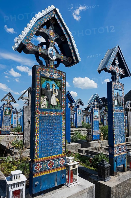 Colourful wooden crosses in Sapân?a, Romania under a blue sky, folk art in a cemetery, traditional wooden grave sites, Happy Cemetery, Cimitirul Vesel, Sapân?a, Sapanta, Maramures, Maramures, Maramures, Maramures, Romania