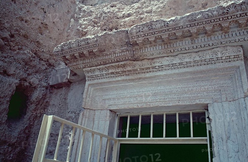 Decorations and inscriptions above the entrance, hypogeum, underground burial chamber of the Three Brothers, Palmyra, Syria, May 1987, vintage, retro, old, historical